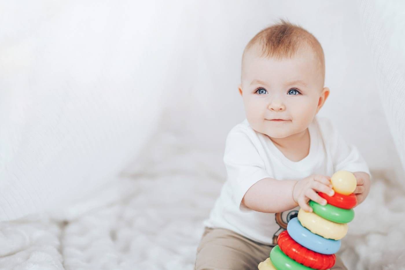 Baby playing with colorful stacking rings