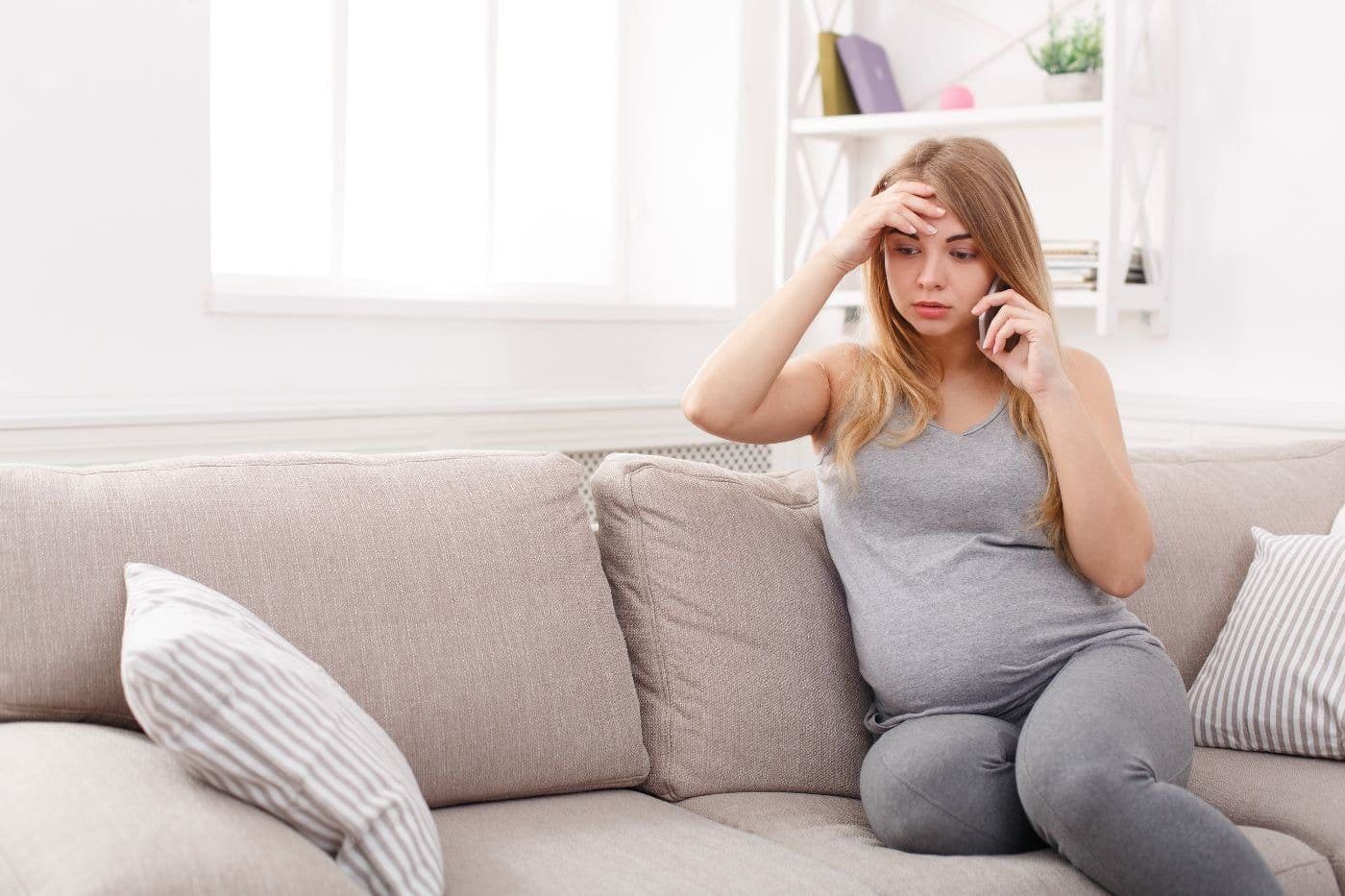 pregnant-mom-worried-on-the-phone