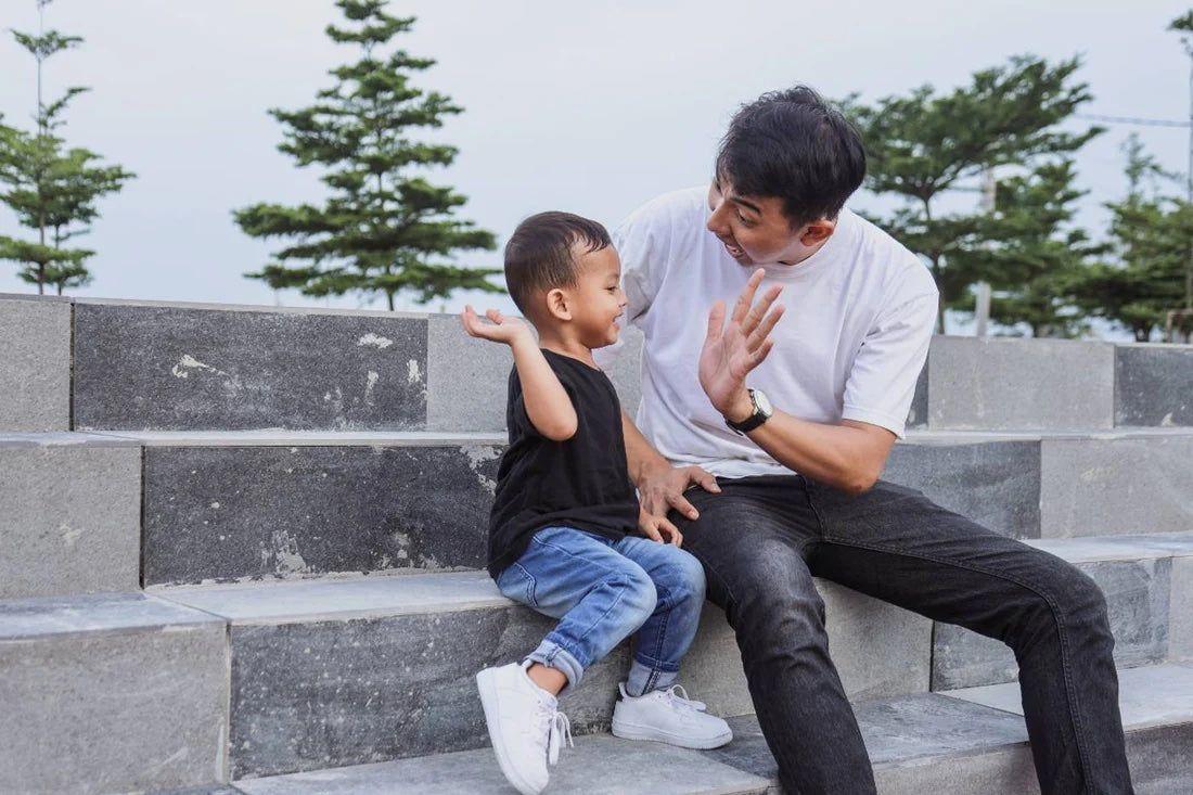 Toddler and father high-five