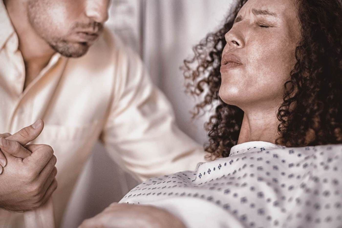 woman-in-labor-with-husband-supporting-her