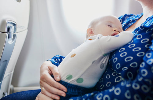 8 Tips That’ll Take the Stress Out of Flying With a Baby