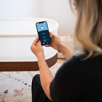 Woman on Happiest Baby App with SNOO